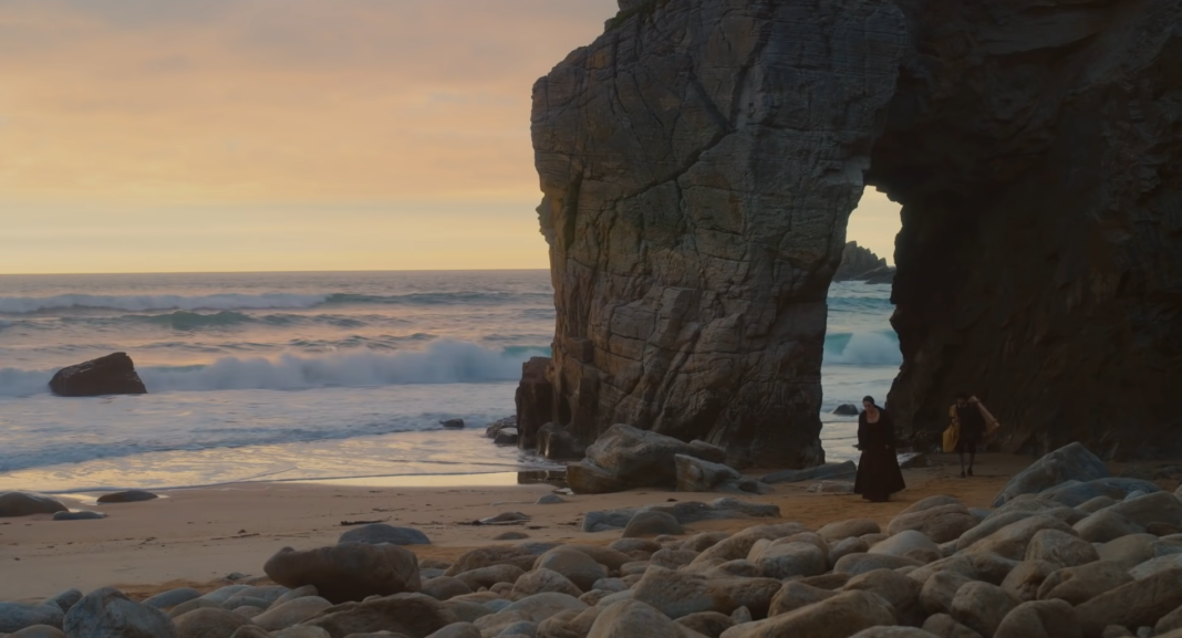 Marianne (Noémie Merlant) arrives by boat on La Grande Plage in Saint-Pierre-Quiberon in Brittany, France, for her secret mission in 